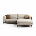 L-vormige bank met stofbekleding en houten poten 220 x 95 x 85cm